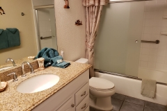 Upgraded Bathroom with new vanity and granite counter top.