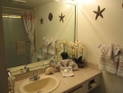 Upgraded master bathroom, tiled vanity top, new tiled shower over tub, floor tile and glass door enclosure