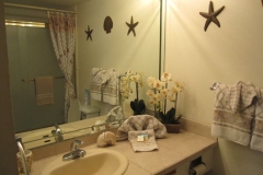 Upgraded master bathroom, tiled vanity top, new tiled shower over tub, floor tile and glass door enclosure