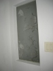 Hall / guest bathroom includes a Custom etched window with tropical scene