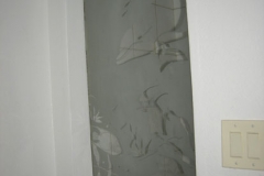 Hall / guest bathroom includes a Custom etched window with tropical scene
