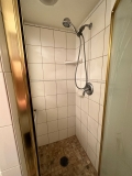 All new shower, custom etched window, tiled vanity top and floor
